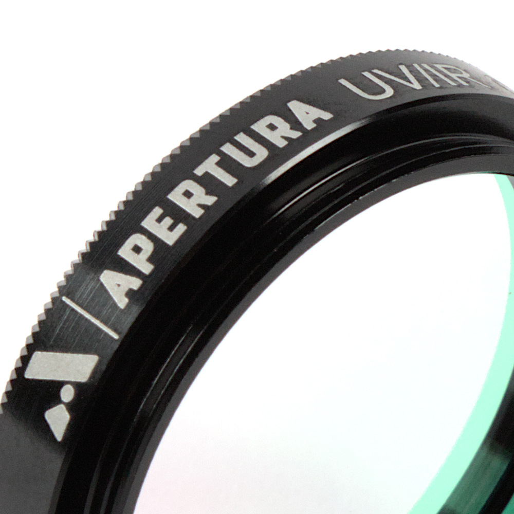 The Apertura 1.25 inch UV/IR astrophotography filter turned at an angle, shot close up showing off the threads.