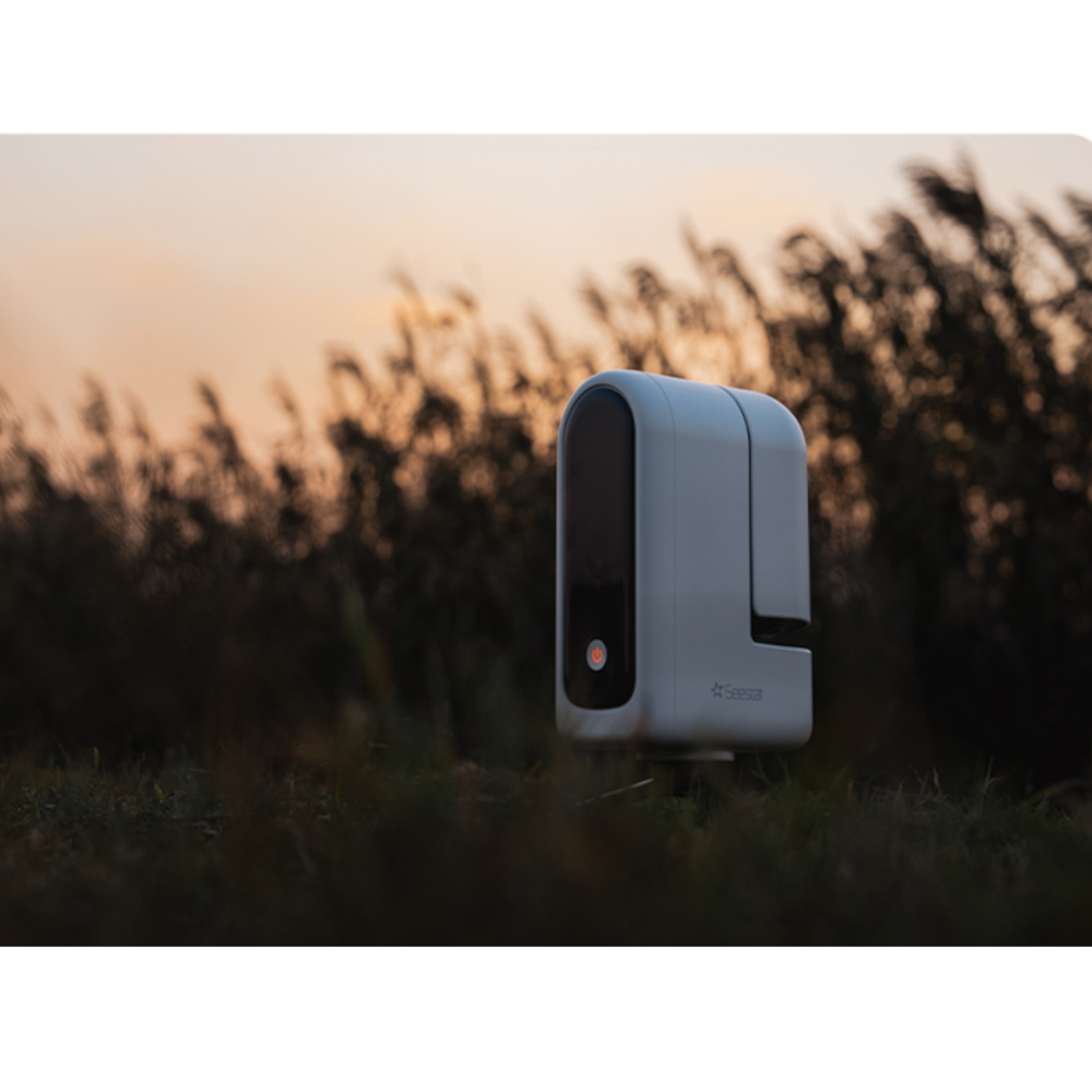 The Seestar S30 All-in-One Smart Telescope sat in a field